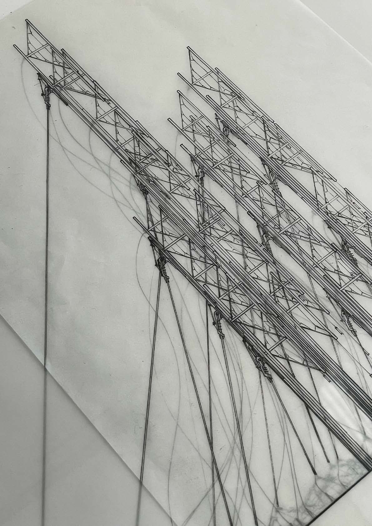 The tower elevation drawn in ink on translucent film — trussed masts and anchor cables photographed at an angle, shadows of the linework bleeding through the sheet
